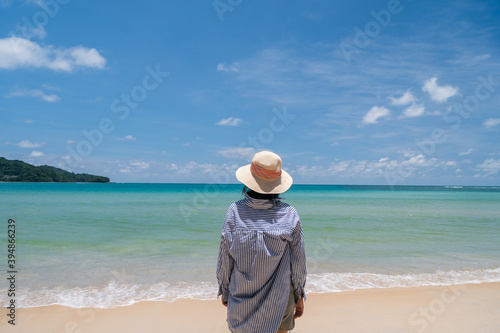 Woman travel around the world with summer beach freedom and relax life.