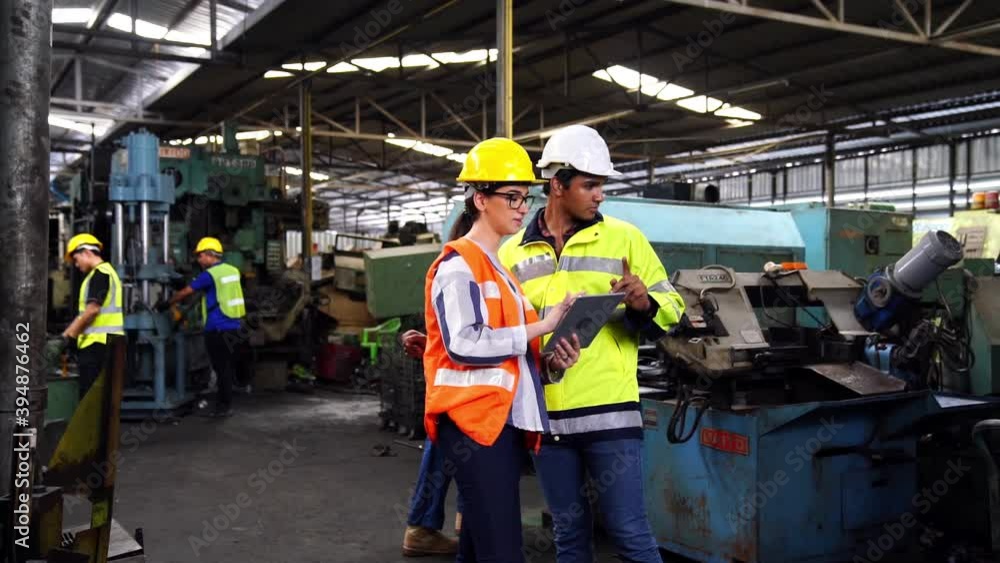 Engineers and industrial workers are working on large machines. Engineers and industrial workers are working on large machines.