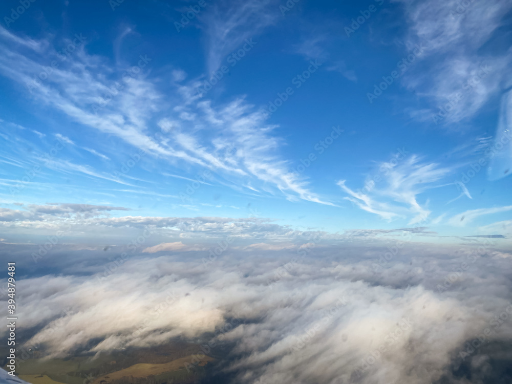 Obraz premium Beautiful aerial view of countryside during sunset from a Plane window