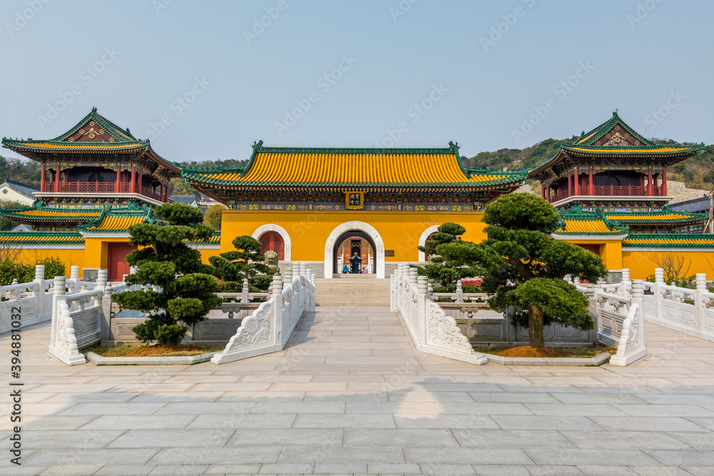 Chinese traditional royal style colorful temples in the Putuoshan mountains, Zhoushan Islands, a renowned site in Chinese bodhimanda of the Guanyin Chinese traditional royal style colorful temples in the Putuoshan mountains, Zhoushan Islands, a renowned site in Chinese bodhimanda of the Guanyin