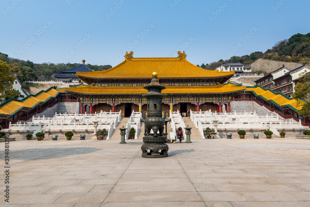Chinese traditional royal style colorful temples in the Putuoshan mountains, Zhoushan Islands, a renowned site in Chinese bodhimanda of the Guanyin Chinese traditional royal style colorful temples in the Putuoshan mountains, Zhoushan Islands, a renowned site in Chinese bodhimanda of the Guanyin