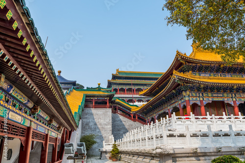 Architectural details of Chinese traditional royal style colorful Baoxiang lecture temples in the Putuoshan mountains, Zhoushan Islands, a renowned site in Chinese bodhimanda of the Guanyin