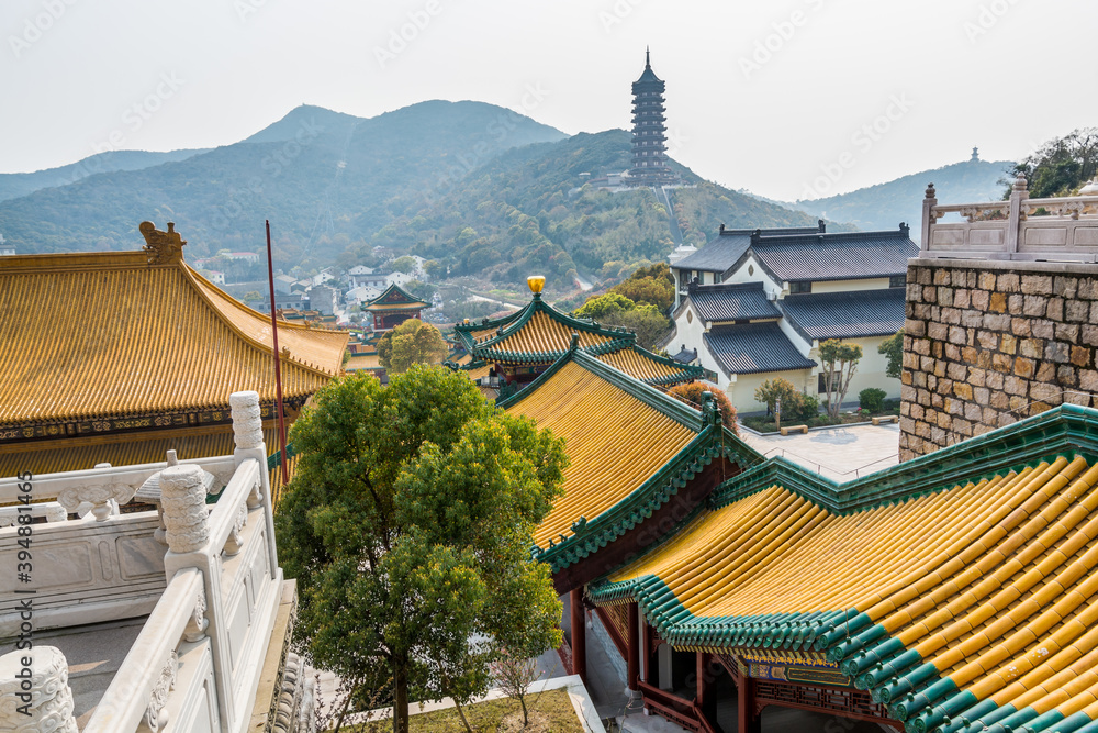 Chinese traditional colorful Baotuo lecture temples in the Putuoshan mountains, Zhoushan Islands,  a renowned site in Chinese bodhimanda of the bodhisattva Avalokitesvara (Guanyin)