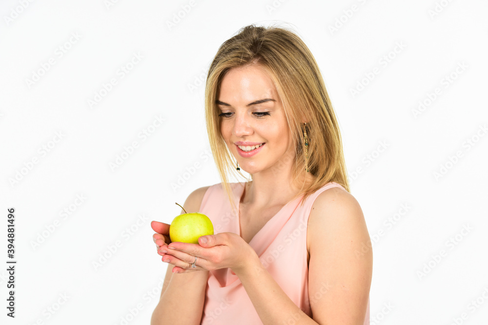 happy woman hold apple. healthy food. full of vitamin. organic and natural eating. good for your teeth health. girl smiling with apple isolated on white. dieting idea. forbidden fruit happy woman hold apple. healthy food. full of vitamin. organic and natural eating. good for your teeth health. girl smiling with apple isolated on white. dieting idea. forbidden fruit