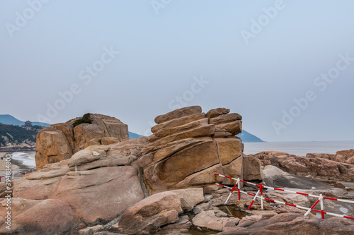 Rocks and beach in the Putuoshan, Zhoushan Islands,  a renowned site in Chinese bodhimanda of the bodhisattva Avalokitesvara (Guanyin) © zz3701