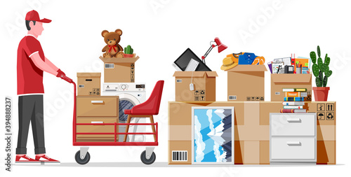 Male mover, hand truck and package for transportation. Moving to new house. Family relocated to new home. Paper cardboard boxes with various household thing. Vector illustration in flat style