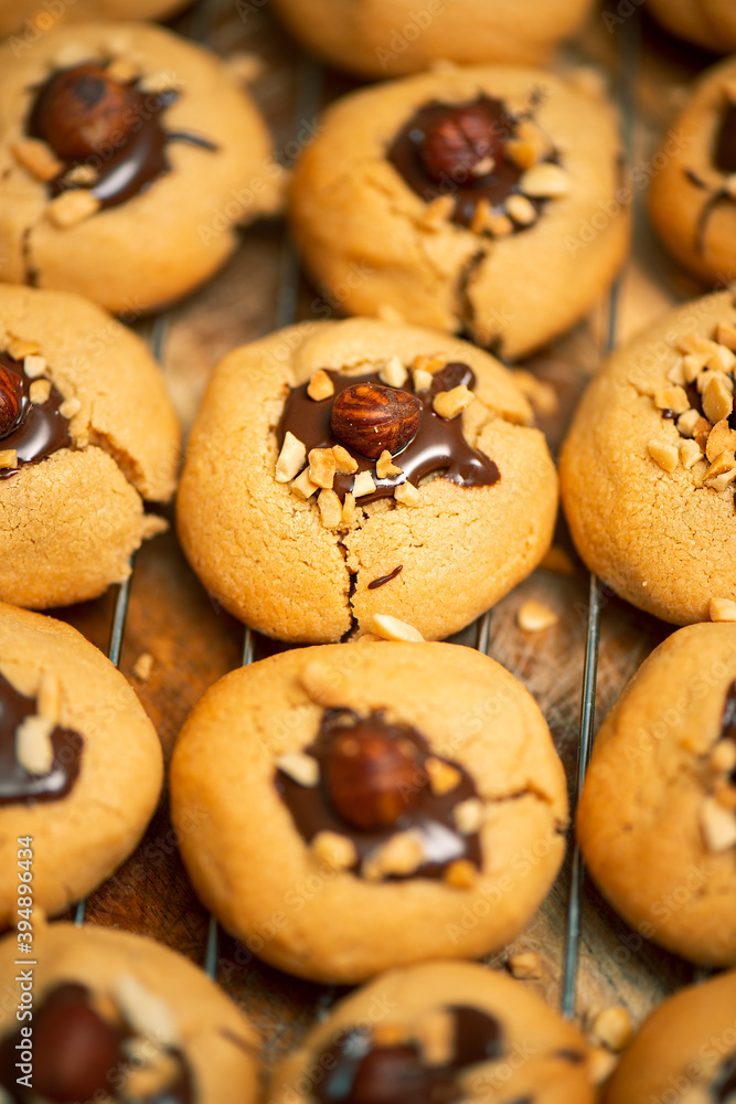 Chocolate nut biscuits just baked, food background.