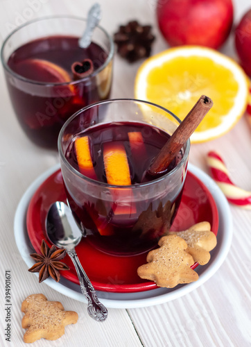 traditional winter warming alcohol cocktail, Christmas homemade mulled wine on white wooden table close up, copy space