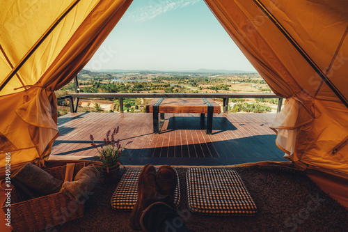 young Thai teen boy brunette tourist adult man asian mature sitting looking into the sky outdoors on a hike mountains viewpoint at chiang mai, mon jam, Thailand.
