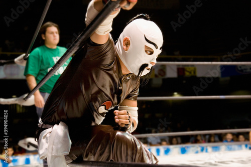 Hispanic man wearing Mexican wrestling costume photo