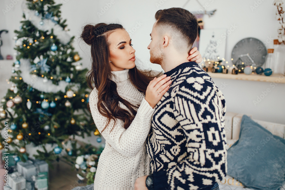 young and pretty couple sitting in a decoration room young and pretty couple sitting in a decoration room