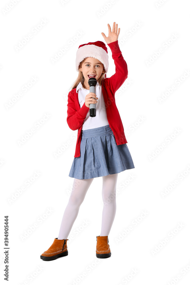 Cute little girl in Santa hat singing Christmas song on white background Cute little girl in Santa hat singing Christmas song on white background