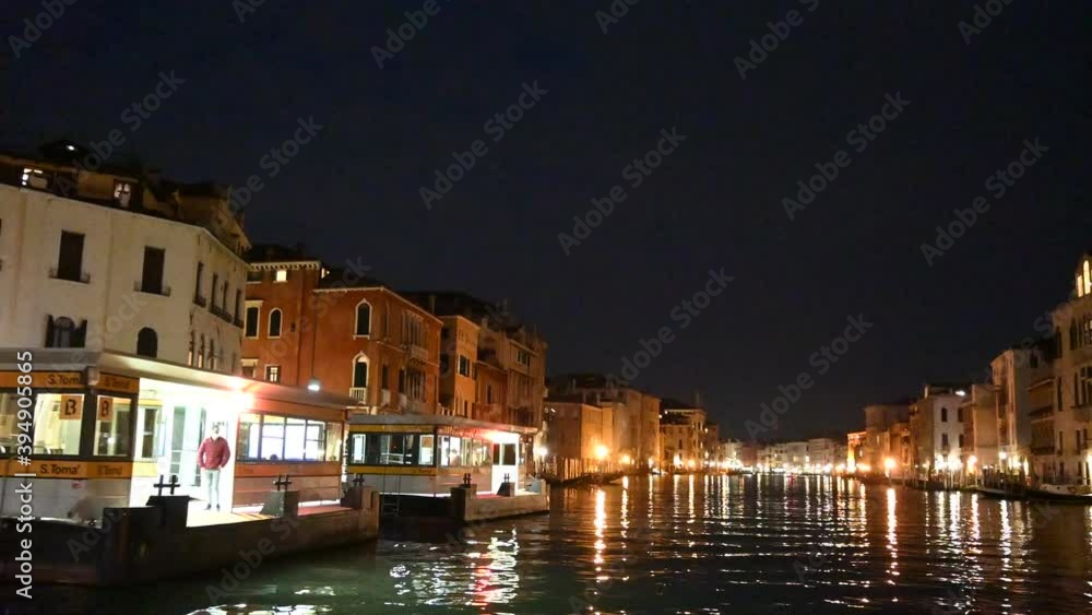 Venice, Italy - November 2020 - The evening lights come on between the palaces and bridges of the Grand Canal Venice, Italy - November 2020 - The evening lights come on between the palaces and bridges of the Grand Canal