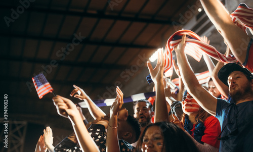 Soccer supporters cheering with USA flags