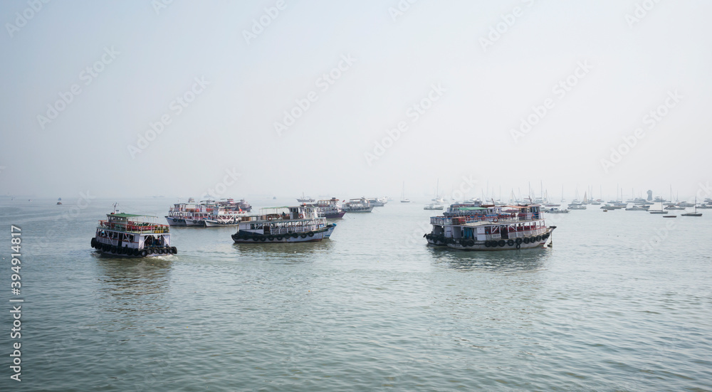 Variety of boats anchored in the water in Mubai Variety of boats anchored in the water in Mubai