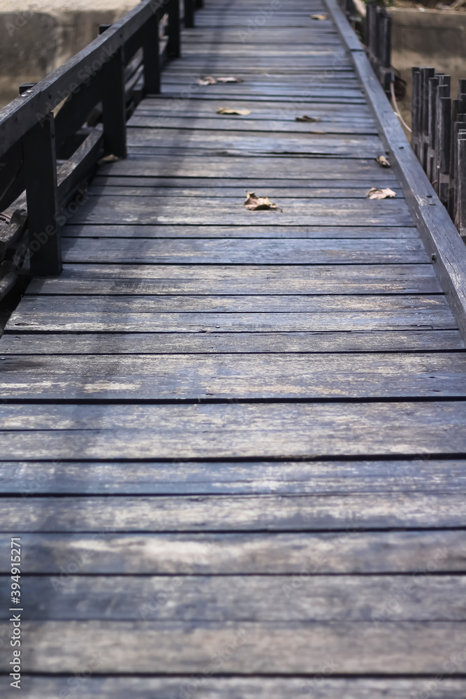 Old wood plank bridge with dry leaf on floor background Old wood plank bridge with dry leaf on floor background
