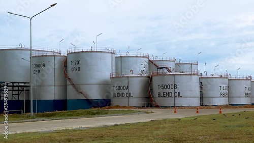 Large palm oil storage tanks in the palm industrial complex.