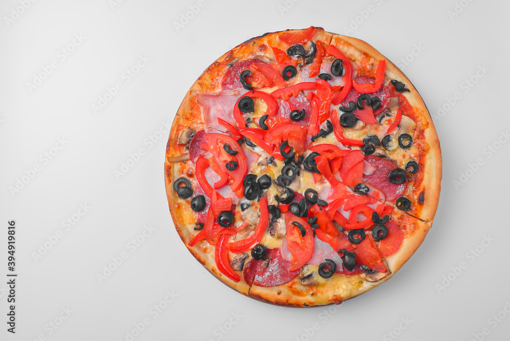 Pepperoni pizza on a white background. Traditional Italian pizza with tomatoes and olives isolated on white. Pepperoni pizza on a white background. Traditional Italian pizza with tomatoes and olives isolated on white.