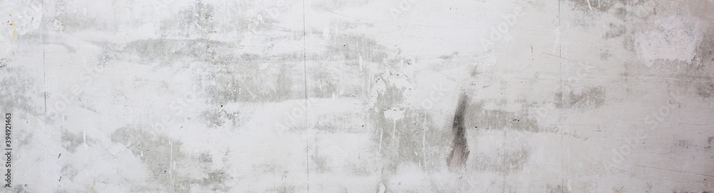 Gray concrete wall peeled wallpaper. Concrete background. Banner.
