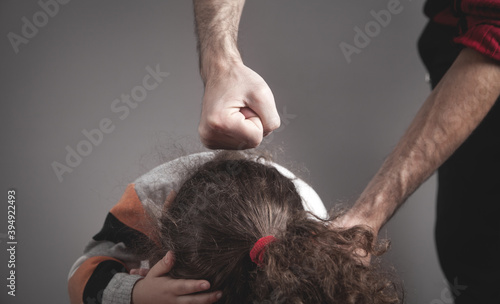 Angry man and little girl. Domestic Violence