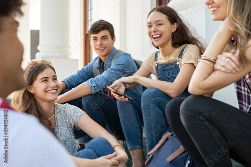 Teenager friends sitting together and laughing Fototapeta