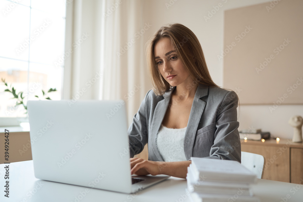 Beauitul young woman working using computer laptop concentrated. High quality photo Beauitul young woman working using computer laptop concentrated. High quality photo