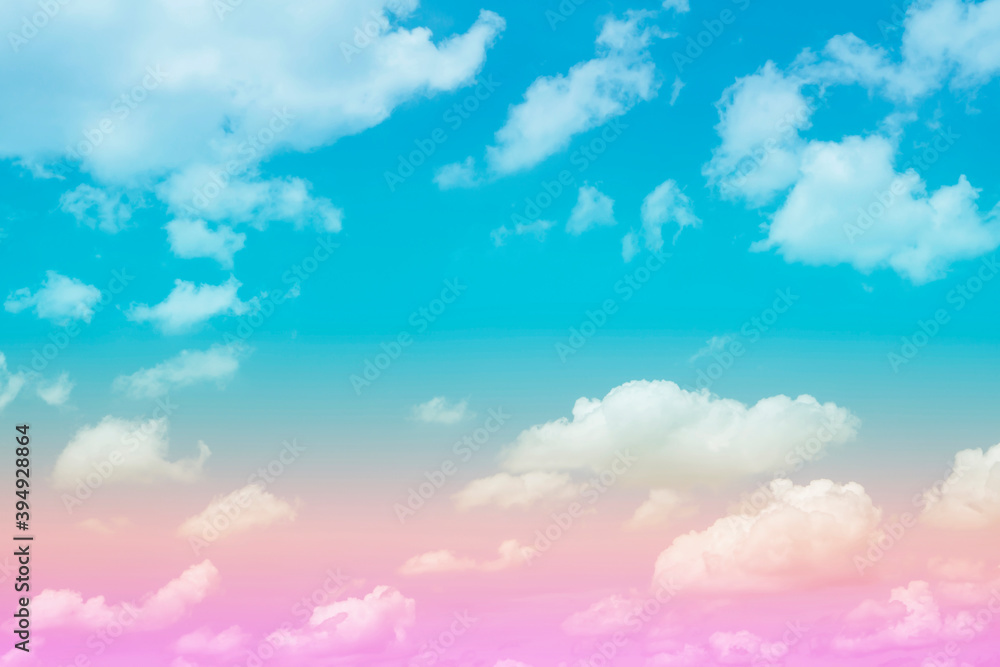 pastel color with rainbow shade on white fluffy clouds, colorful blue sky 