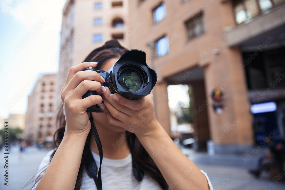 Woman photographer with a professional camera