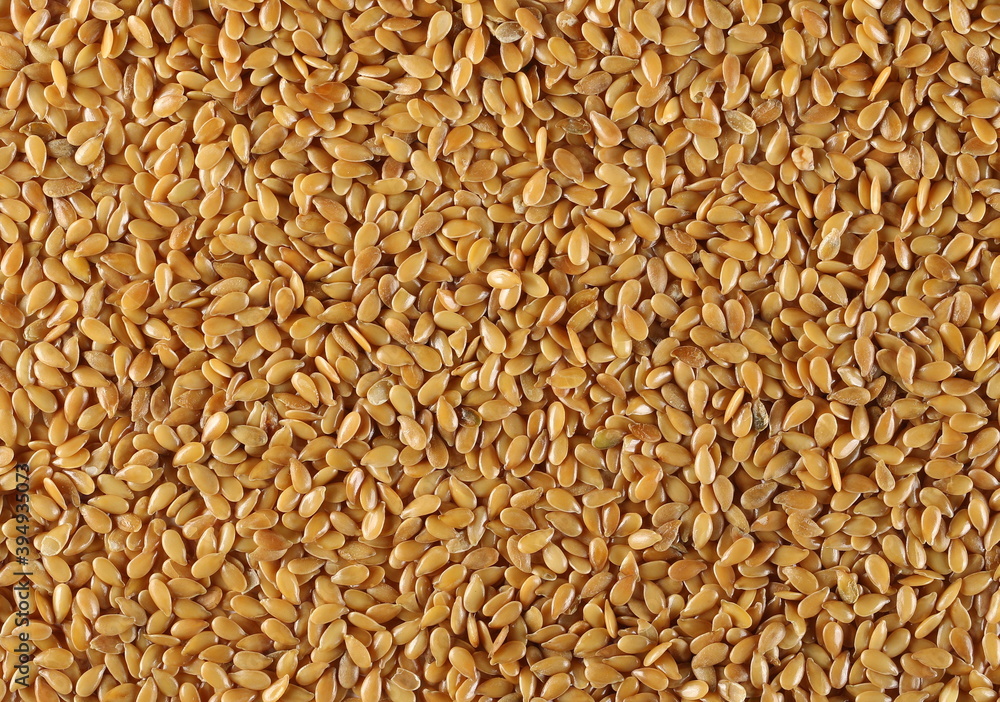 Golden linseed, linen seeds background and texture, backdrop Golden linseed, linen seeds background and texture, backdrop
