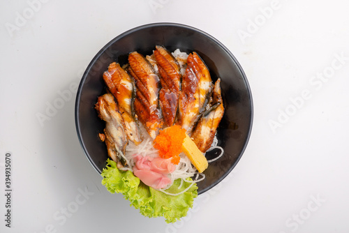 grilled unagi donburi - japanese grilled eel rice bowl photo