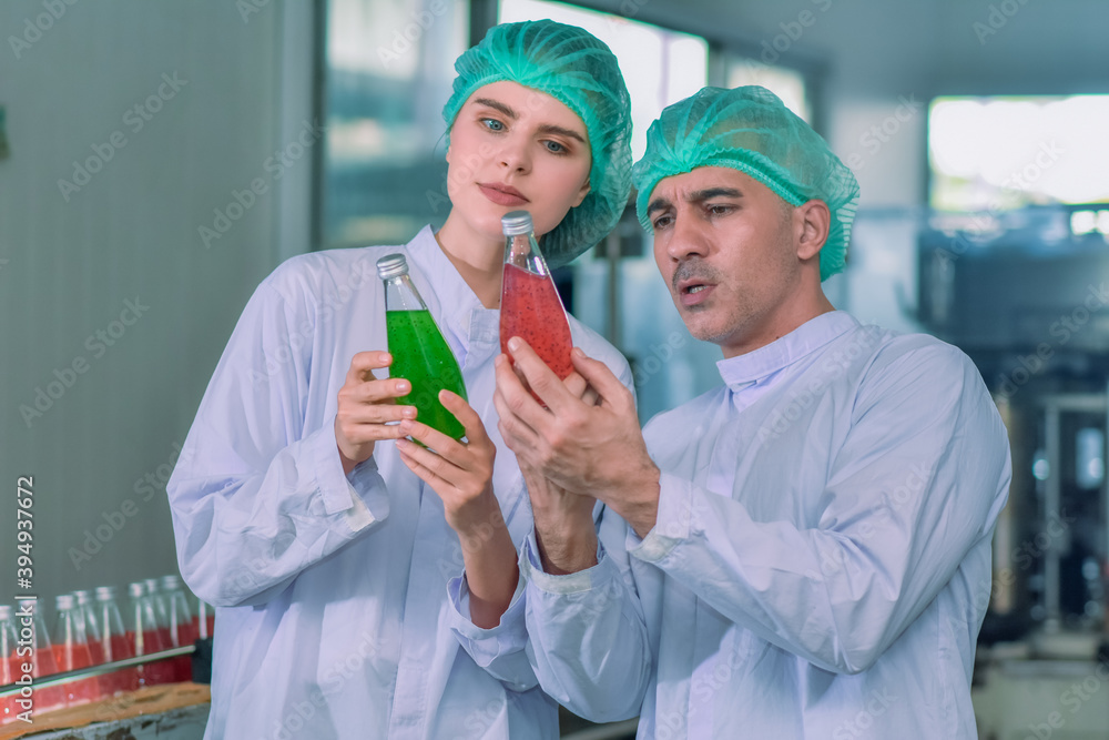 Worker people check quality control in production process beverage in factory