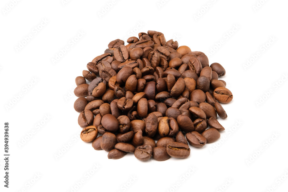 Coffee beans lie in a heap isolated on a white background. Coffee beans lie in a heap isolated on a white background.