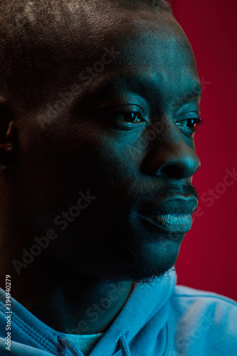 Close-up of African man isolated on pink background