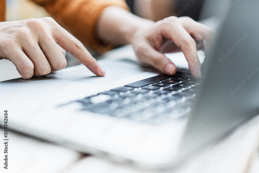 person typing on a laptop keyboard person typing on a laptop keyboard