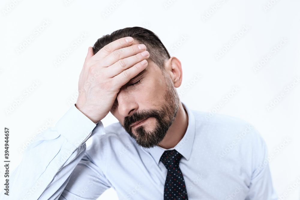 The man put his hand on his forehead. The man put his hand on his forehead.