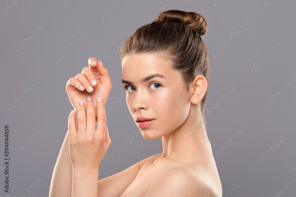 Sexy naked young woman posing on grey Stock Photo Adobe Stock