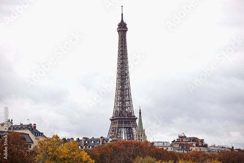Eiffel tower with autumn leafs, Paris, France.