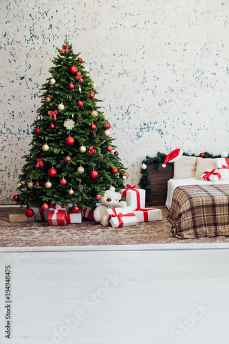 Beautiful decorated room with Christmas tree with presents under it