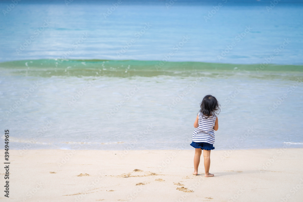 Active little girl playing at sea shore in Phang Nga Thailand. Active little girl playing at sea shore in Phang Nga Thailand.