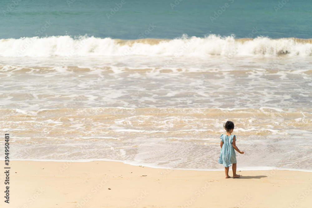 Active asian girl playing at sea shore in Phang Nga Thailand. Active asian girl playing at sea shore in Phang Nga Thailand.