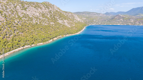 Peloponnese, Greece Aerial view on turqouise blue water and sandy beach. Limni Vouliagmeni or Ireon Lake, 