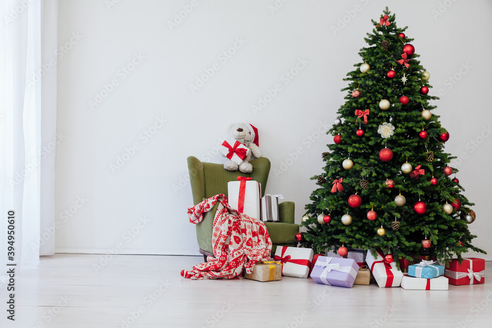 Christmas tree with presents underneath in living room