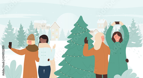 Happy people make selfie vector illustration. Cartoon girl friends characters taking selfie with camera phones, standing near decorated Christmas fir tree in snow xmas winter landscape background