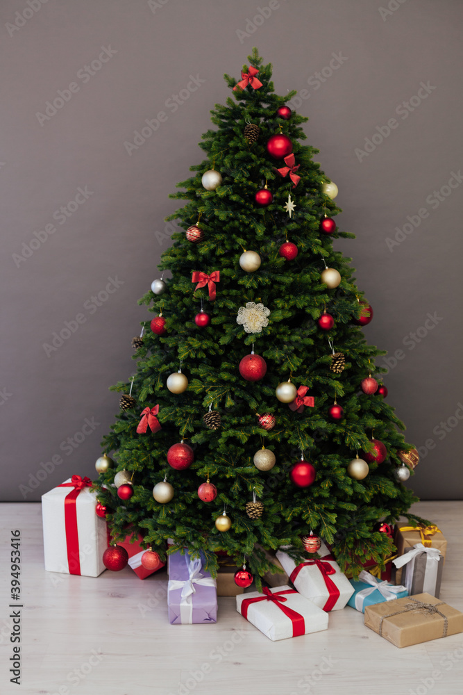 Perfect Christmas tree with gifts underneath in living room Perfect Christmas tree with gifts underneath in living room