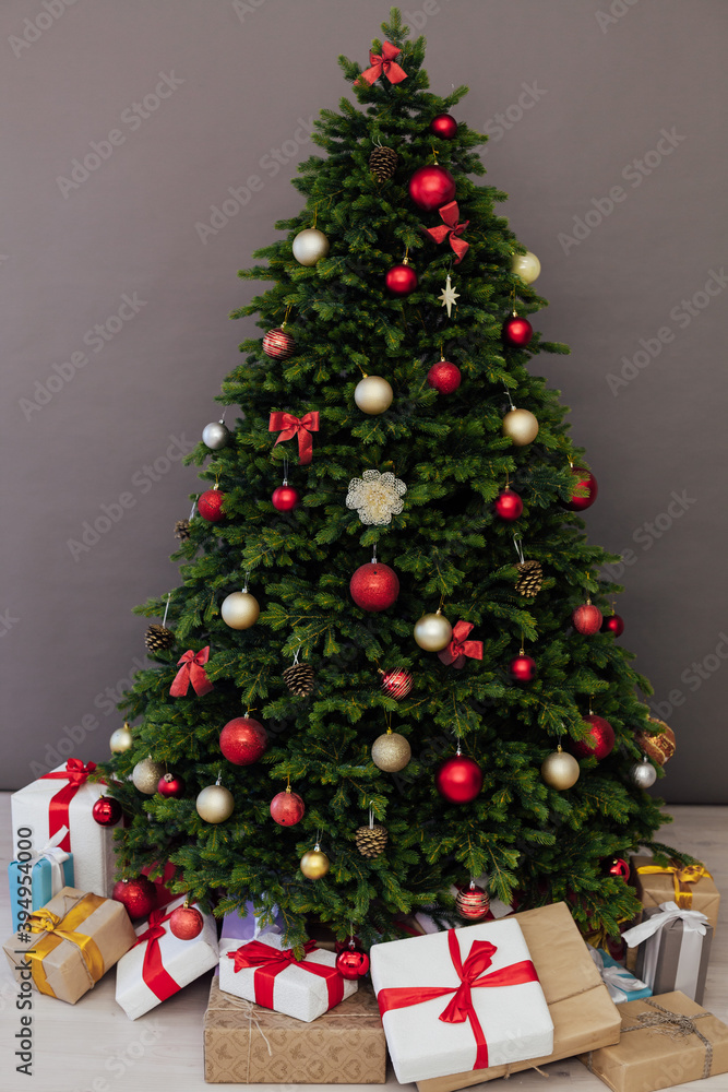 Perfect Christmas tree with gifts underneath in living room