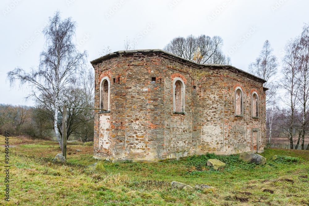 Branisov / Czech Republic - November 15 2020: View of the ruined baroque church of St. Blazej with no roof made of stones and bricks, a former pilgrimage church. It is surrounded with birch trees.