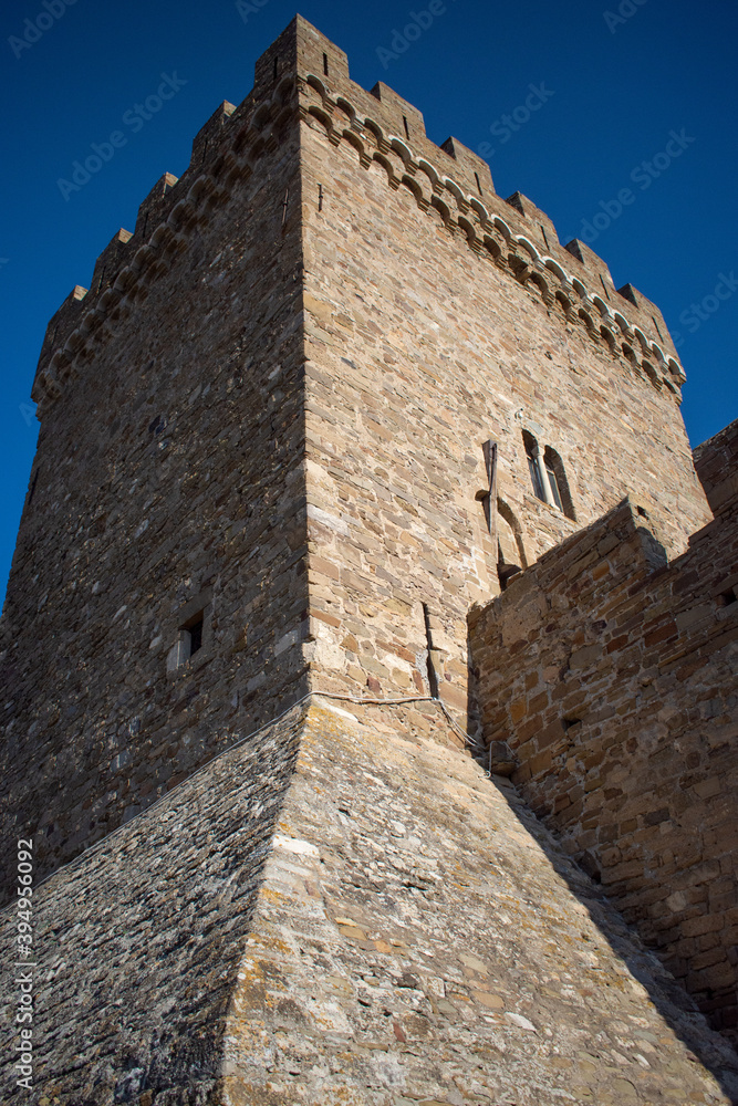 medieval fortress tower against blue sky
medieval fortress tower against blue sky