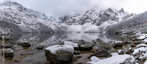 Fototapeta Naklejka Na Ścianę i Meble -  Panoramic view of scenic idyllic winter landscape in the poland tatras at famous mountain lake Eye of the Sea or Morskie Oko, Tatras Mountain poland