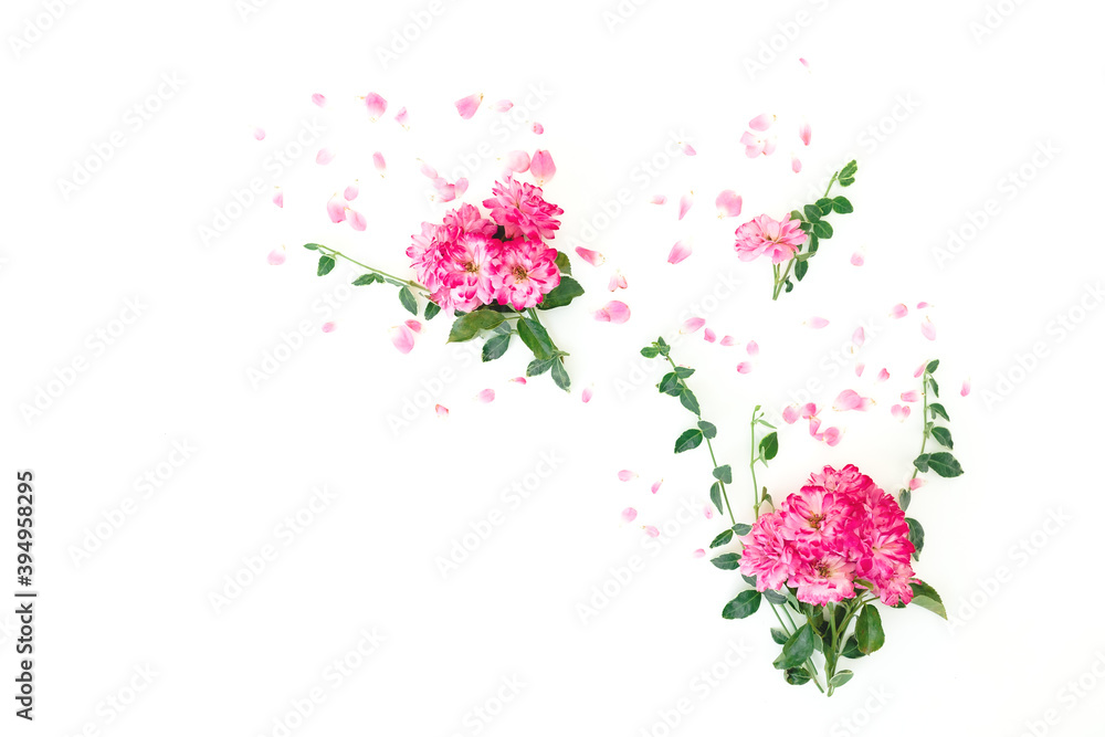 Pink roses flowers with leaves and petals on white background. Flat lay Pink roses flowers with leaves and petals on white background. Flat lay