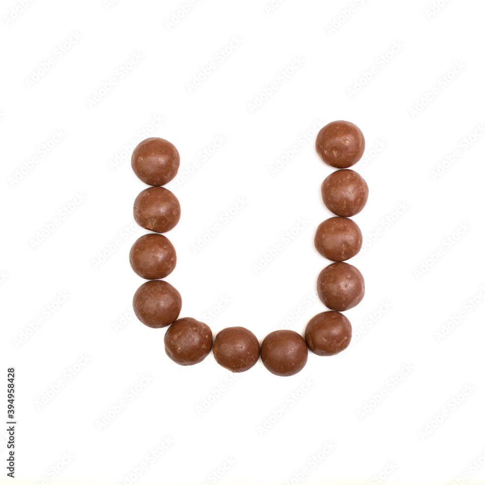 The 'U' written in chocolate Pepernoten The 'U' written in chocolate Pepernoten
